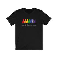 Friends are the Family we Choose Unisex Jersey Tee  - Image Description - Black t-shirt with Friends written in the middle of 7 sitting dogs in rainbow colors, with are the family we choose in white under the 7 dogs.