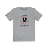 Foster to Forever - Image of grey t-shirt with an image of  a black silhouette of a woman standing next to a man with a dog sitting between them surrounded by a red line drawn heart.  The word Foster is above the image and the words to Forever are under the image. 