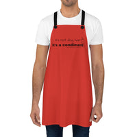 It's a Condiment Ketchup Apron - Image of a male wearing a white t-shirt, jeans and the ketchup colored red apron with saying It's not dog hair it's a condiment with an outline of a condiment bottle.