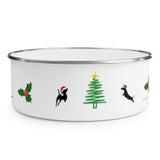 Dogs Holiday Cheer Enamel Bowl - White bowl with stainless steel rim decorated with a holly with 3 berries, silhouettes of 2 dogs wearing santa hats jumping towards a green line Christmas tree with a yellow star.