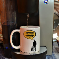 What I Like Best About People 11oz Mug - This image has a white mug with a silhouette of a dog sitting next to a guy standing with a bright yellow speech bubble coming from the man. The man says," You know what I like best about people?" The mug is sitting on a one cup coffee machine with coffee being dispensed into the mug.