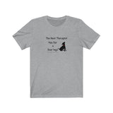 Best Therapist Has Fur & Four Legs Tee - Image description Athletic Heather Grey t-shirt with a small black puppy with red collar sittings with The Best Therapist Has fur and four legs in a black handwritten text.