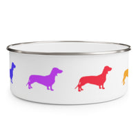 Dachshund Rainbow Enamel Bowl – Image Description – White enamel bowl with a silver rim displaying the front part of an indigo dachshund, a violet dachshund, a red dachshund and, the back part of an orange dachshund equally spaced around the side of the bowl. 