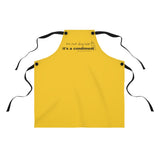 It's a Condiment Mustard Apron - Image description - mustard colored yellow apron with saying It's not dog hair it's a condiment with an outline of a condiment with 4 black ties attached to the red apron with black buttons on a white background. 